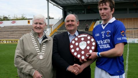 Fenians Captain John Henderson accepting Shield from Co Board Chairman Ned Quinn and President St Canices Credit Union Michael O Reilly