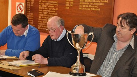 Paul Kavanagh makes the JJ Kavanagh and Sons Northern Draws for 2012 as secretary PJ Kenny records and chairman Donal Brennan awaits the next team out of the Cup
