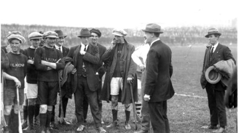 Michael Collins addresses the Kilkenny team before the Leinster Final against Dublin, Sept 1921. In one of his first appearances after the Truce, Collins said - "You are not only upholding the great game, but you are also upholding one of the most ancient and cherished traditions in Ireland." From left:- Paddy Donoghue (Dicksboro), Mattie Power (Dicksboro), Dick Grace (Tullaroan), Michael Joyce (Callan), Martin Egan (Threecastles), Bill Kenny (Lisdowney), Jack Holohan (from Johnstown played with Tullaroan), Michael Collins and Harry Boland. Collins and Boland, (Chairman, Dublin Co Board and Sinn Fein TD for Roscommon) though great friends, found themselves on opposite sides in the Civil War which would claim both their lives within a year.