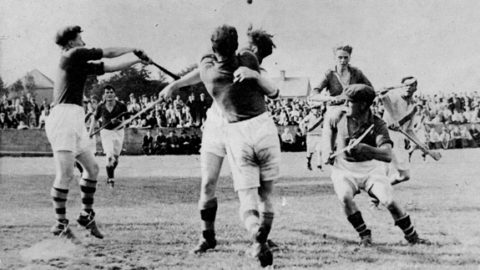 Action from the 1947 County Final between Eire Og and Tullaroan. Eire Og Goalie, Ramie Dowling, keeps his eye on the ball as defenders, Nick O'Donnell, Ches Phelan, Diamond Hayden (cap) and Michael Neary close in. The Hennessy brothers and John Walton are the Tullaroan Players.
